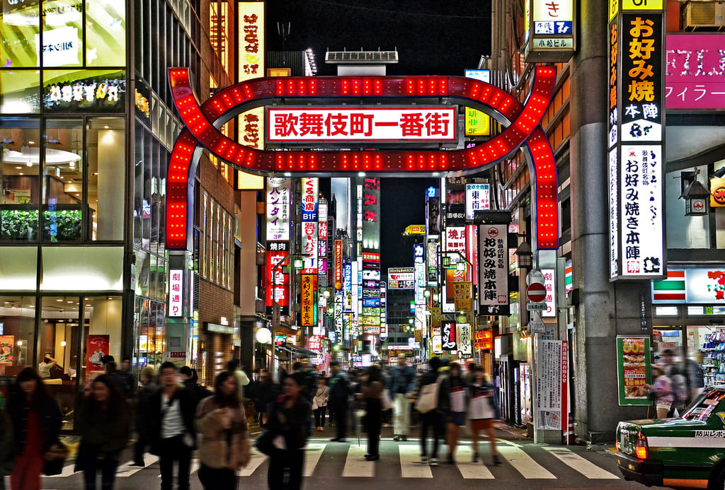 Original city street photo with neon lights before glitch art effects