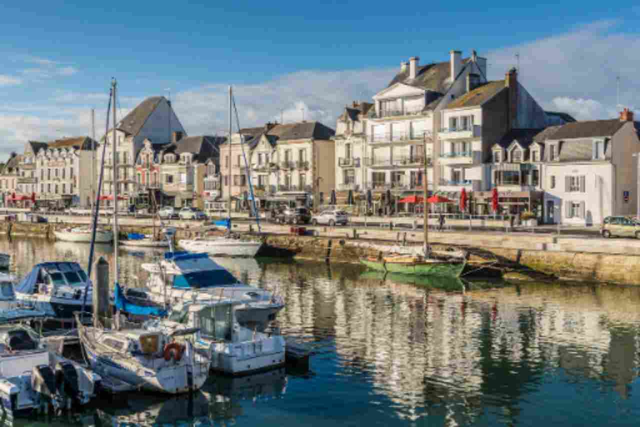 The same harbor photo turned into a low quality image with compression artifacts and pixelation
