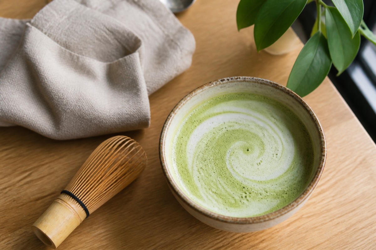 Original cafe still-life photo of a matcha latte before applying a matcha filter